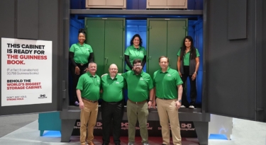 Strong Hold team in the world's largest storage cabinet