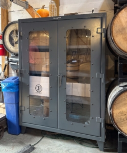 Strong Hold clear view cabinet in a distillery setting