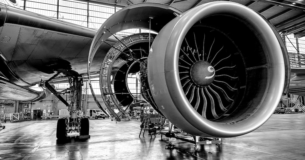 Commercial jet engine undergoing maintenance in a hangar