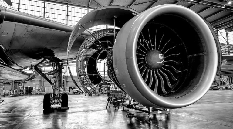 Commercial jet engine undergoing maintenance in a hangar