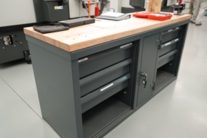 WPCC Welding Classroom with ustom 7-gauge steel shop tables with predrilled holes for mounting vises