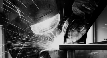 Welder working in the Strong Hold production facility